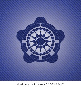 sun icon inside badge with denim texture