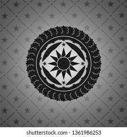 sun icon inside black badge