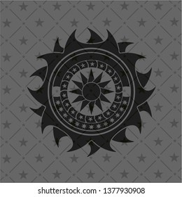 sun icon inside black emblem