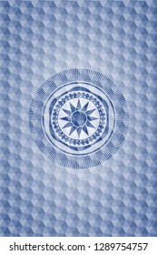 sun icon inside blue badge with geometric background.