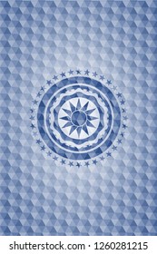sun icon inside blue emblem or badge with geometric pattern background.