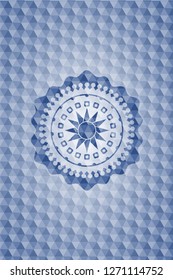 sun icon inside blue emblem with geometric pattern.