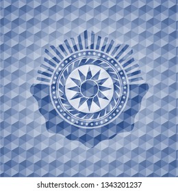 sun icon inside blue emblem or badge with abstract geometric polygonal pattern background.