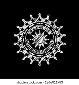sun icon inside chalkboard emblem