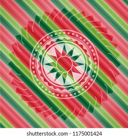 sun icon inside christmas colors emblem.