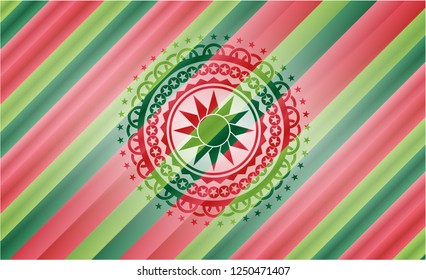 sun icon inside christmas style emblem.