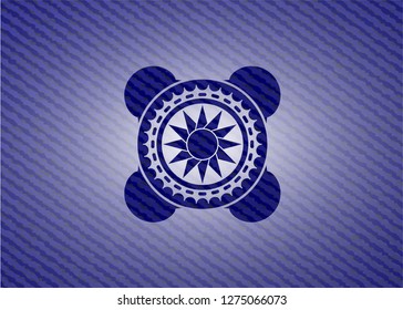sun icon inside denim background