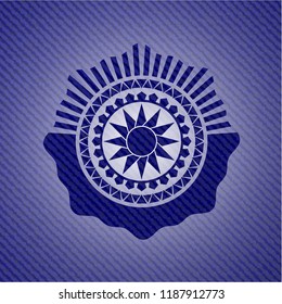 sun icon inside emblem with denim high quality background