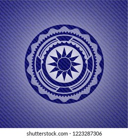 sun icon inside emblem with jean high quality background