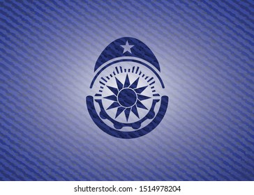 sun icon inside emblem with jean texture