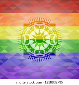 sun icon inside emblem on mosaic background with the colors of the LGBT flag