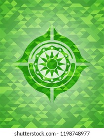 sun icon inside green emblem with mosaic ecological style background