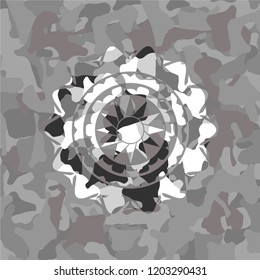 sun icon inside grey camouflage texture