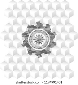 sun icon inside grey emblem with geometric cube white background