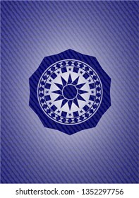 sun icon inside jean or denim emblem or badge background