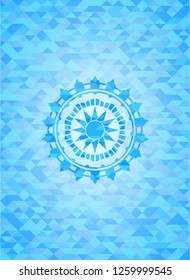 sun icon inside light blue emblem with mosaic background