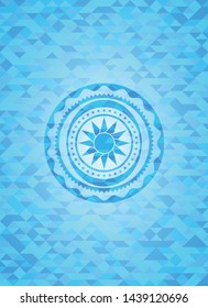 sun icon inside light blue emblem with mosaic background