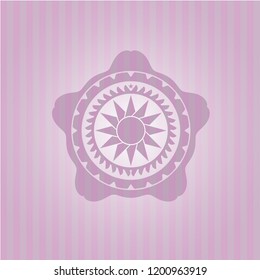 sun icon inside pink emblem