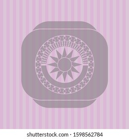 sun icon inside pink emblem
