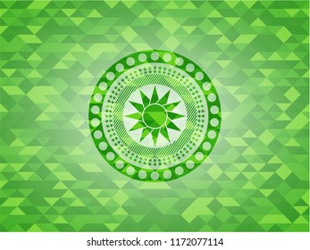 sun icon inside realistic green emblem. Mosaic background