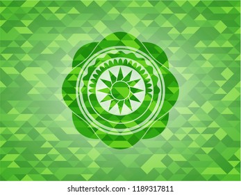 sun icon inside realistic green emblem. Mosaic background