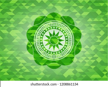 sun icon inside realistic green mosaic emblem