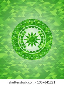 sun icon inside realistic green emblem. Mosaic background