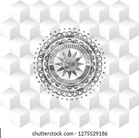 sun icon inside realistic grey emblem with geometric cube white background