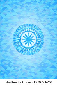 sun icon inside realistic light blue mosaic emblem