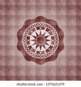 sun icon inside red seamless emblem or badge with abstract geometric pattern background.