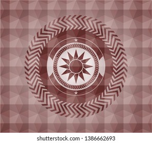 sun icon inside red seamless geometric emblem.