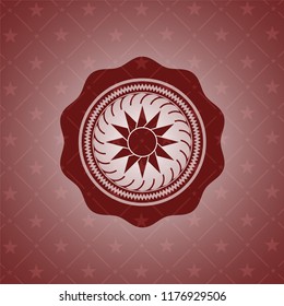 sun icon inside retro red emblem
