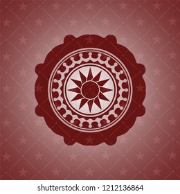 sun icon inside retro style red emblem