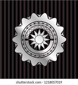 sun icon inside silver badge