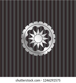 sun icon inside silver emblem