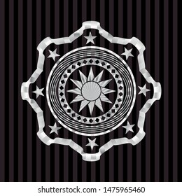 sun icon inside silver emblem