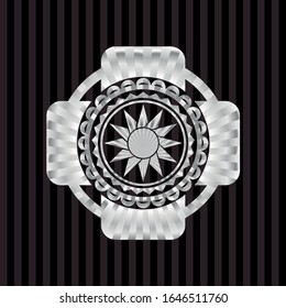 sun icon inside silver emblem