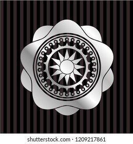 sun icon inside silver shiny emblem