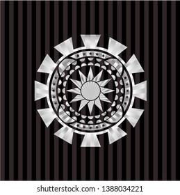 sun icon inside silvery badge