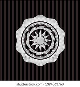 sun icon inside silvery badge or emblem