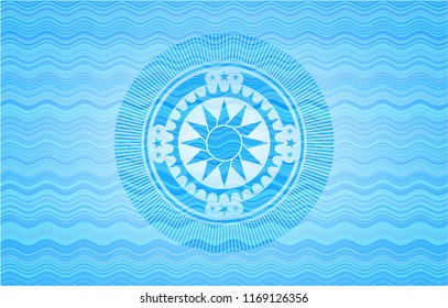 sun icon inside sky blue water emblem.