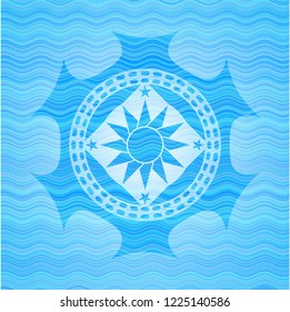 sun icon inside sky blue water badge background.