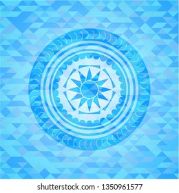 sun icon inside sky blue mosaic emblem