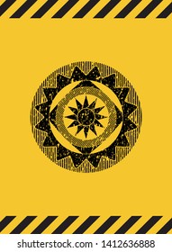 sun icon inside warning sign, black grunge emblem. Vector Illustration. Detailed.