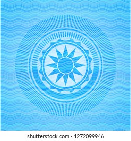 sun icon inside water wave representation style badge.