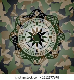 sun icon on camouflaged pattern
