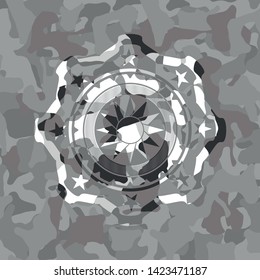 sun icon on grey camouflage texture