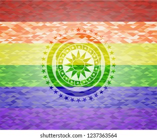 sun icon on mosaic background with the colors of the LGBT flag