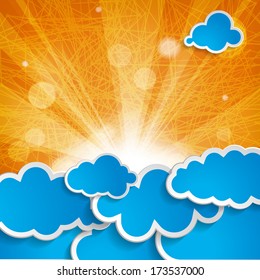 sun with rays and blue clouds on an orange background 