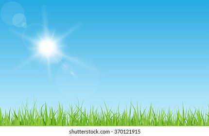 Sun With Rays And Flares On Blue Sky. Green Grass Lawn.